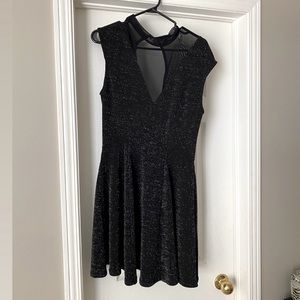 Black sparkly top, with sheer V neck